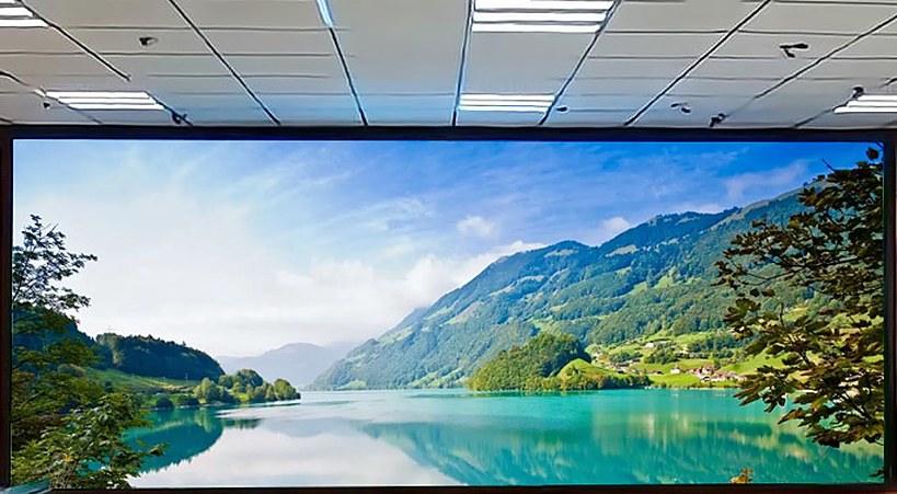 LED feature wall in a public hall showing a mountain lake