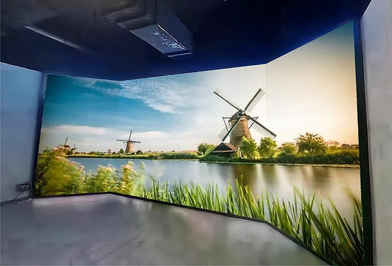 Curved LED walls wrapping a studio, showing a windmill landscape